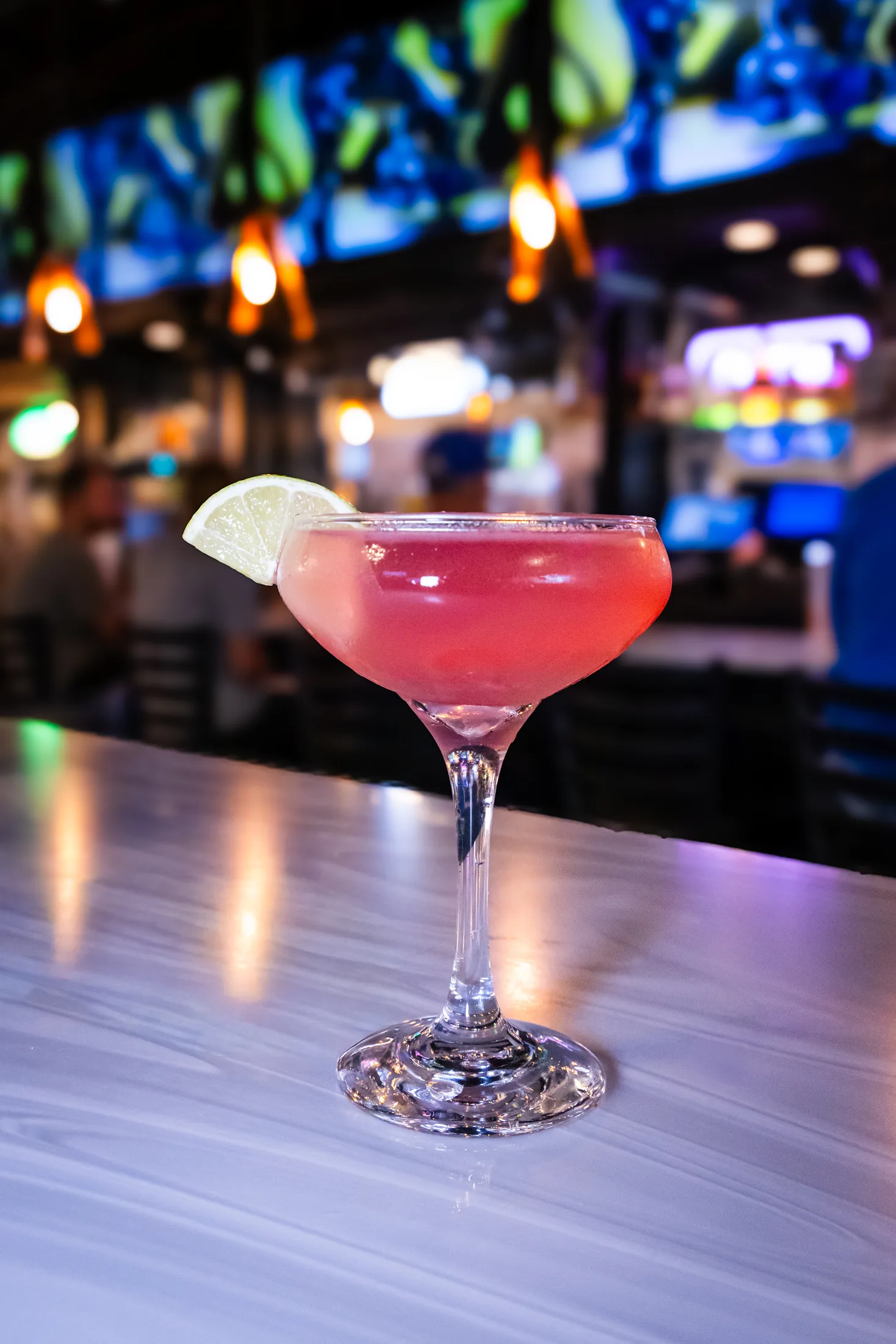 Pink cocktail in a coupe glass at Jameson's